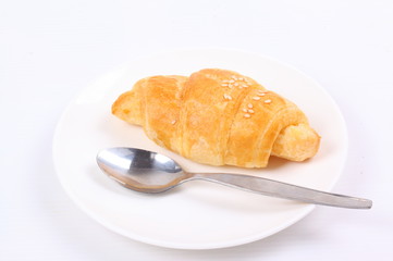 Fresh and tasty croissant on white background