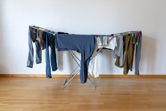 Indoor Balcony Folding Clothes Drying Rack In An Empty Room