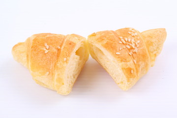 Fresh and tasty croissant on white background