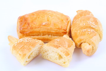 Fresh and tasty croissant on white background