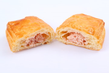 Fresh and tasty croissant on white background