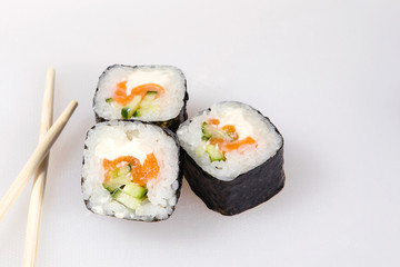 Set of eel sushi rolls with chopsticks.