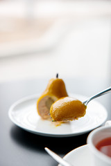 cut and slice of pear mousse cake yellow
