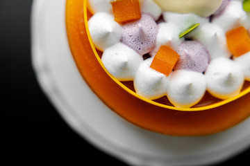 yellow cake mango passion fruit mousse on a stand