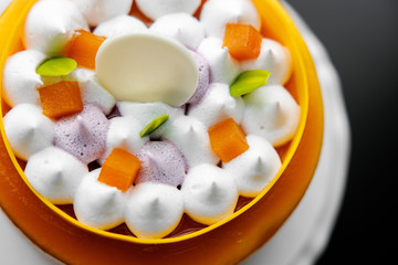 yellow cake mango passion fruit mousse on a stand