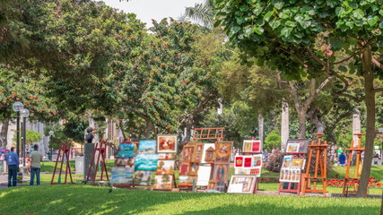 Miraflores central park timelapse. Place for relax with green trees and lawn in Peruvian capital....