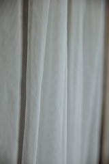 Obraz premium white fabric curtain tulle waves