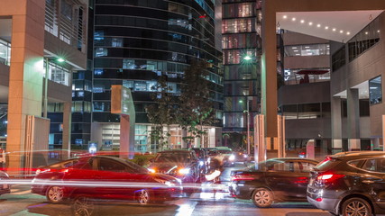 Night cityscape in business area with illuminated skyscrapers timelapse. San Isidro district Lima,...