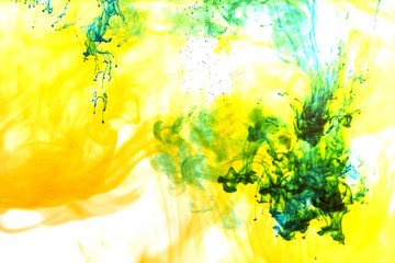 Colored ink cloud grows in water. Astract shape background.