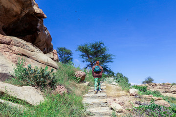 Woman Tourist going to the Laas Geel cave formations - an earliest known cave paintings in the Horn...