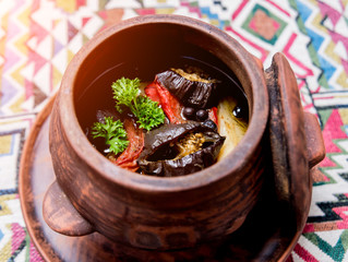 Potatoes with meat and vegetables in clay pot. Georgian national cuisine. 