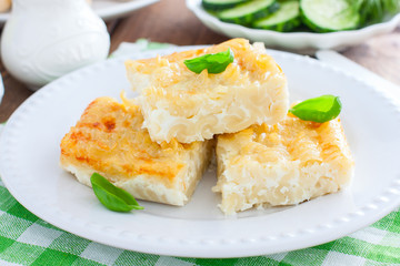 Pasta casserole with egg, sliced into pieces, selective focus