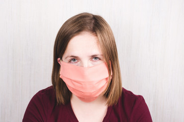 Coronavirus. Woman in quarantine for coronavirus wearing handmade protective mask..staying home...