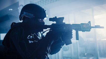 Close Up Portrait of Masked Squad Member of Armed SWAT Police Officers Who Storm a Dark Seized...