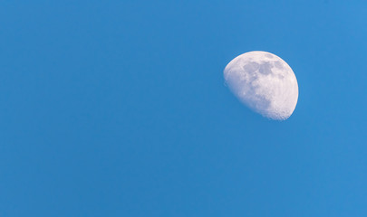 Three Quarter Moon in a Blue Sky