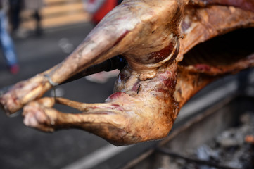 Lamb on the spit cooked on jar in a marketplace