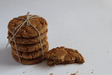 oatmeal cookies stacked on a white background
