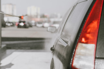 rinsing and applying wax to the car body by pressure treated water at a self-service station