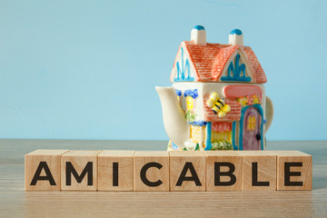 Amicable - word on wooden cubes, concept family