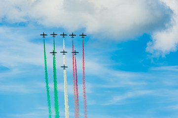 Frecce Tricolori making the Italian flag with smoke.