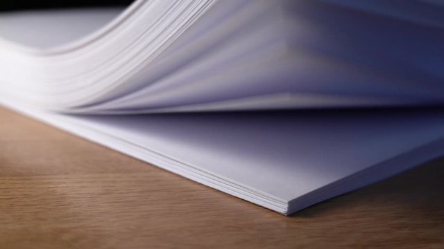 Flipping paper, slow motion video