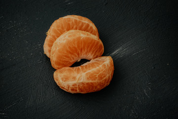 peeled tangerines on the plate