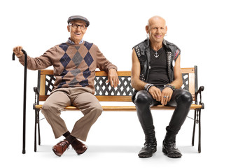 Punk and senior man sitting on a bench