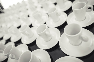 Coffee cups aligned on a table
