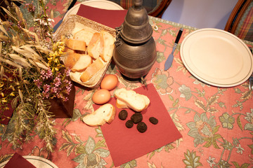 black truffle, bread, eggs still life table