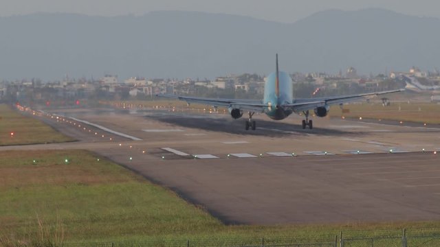 Planes take off and land on the runway of the Vietnamese airport.