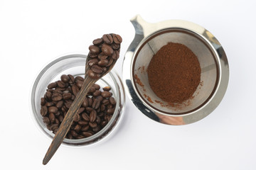 Coffee Beans And Ground Coffee on white background