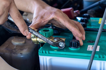 Repairing the battery by a technician from the service center. Service shop Battery repair