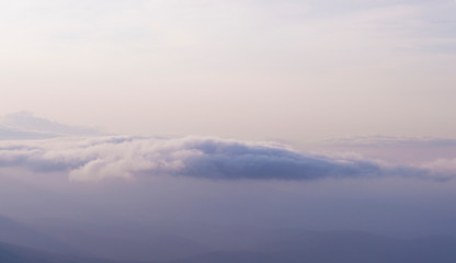 Obraz premium clouds on a background of mountains in a haze