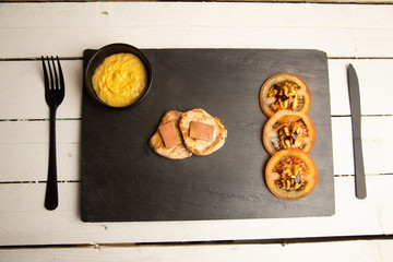 Pork tenderloin dish with pate and tomato and walnut salad