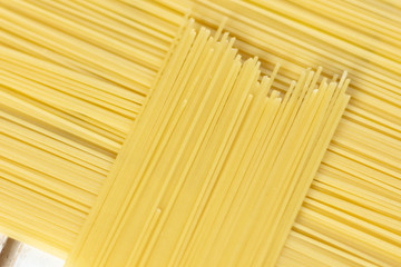 Italian uncooked long spaghetti as perpendicular  line background