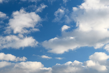 Blue sky with bright white clouds.