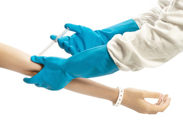 doctor in ppe suit injects medicine into patient arm