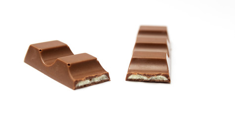 Broken chocolate bar isolated on a white background.