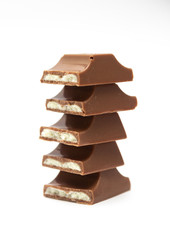 Broken chocolate bar isolated on a white background.