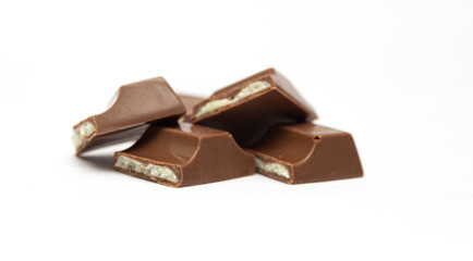 Broken chocolate bar isolated on a white background.