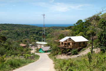 Fototapeta na wymiar Roatan Island Village Telecommunication Tower