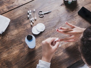 girls hands having her nails done