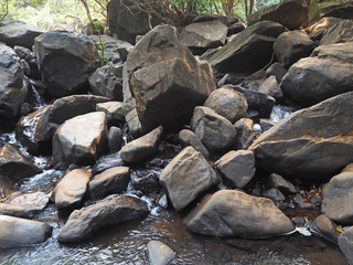 Beautiful landscape with huge boulders through which the river flows slowly