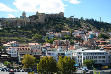 Naklejka premium Tbilisi, Georgia - October 4, 2018: View from Metekhi St. Virgin Church and Statue of King Vakhtang Gorgasali