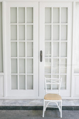 a chair and white door on background