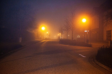 Fog in empty street at night