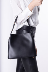  Model girl with leather elegant women bag. Fashionable female handbag, isolated