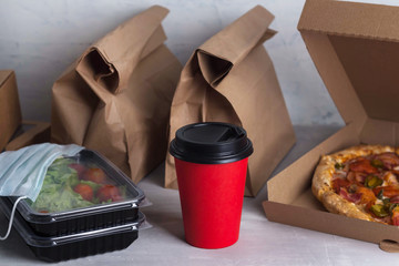 food delivery in paper bags and boxes, contactless delivery during the coronavirus epidemic