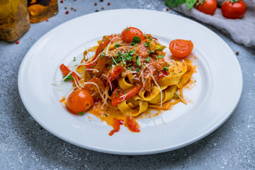 Pasta Fettuccine arabiata on white plate