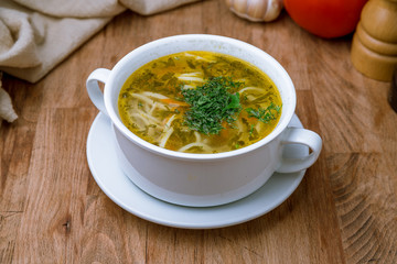 Chicken soup bouillon in a plate